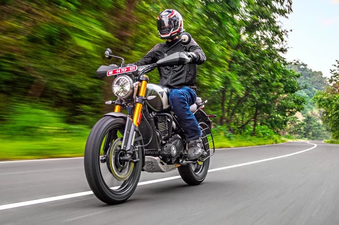 Triumph Scrambler 400 X front left riding shot